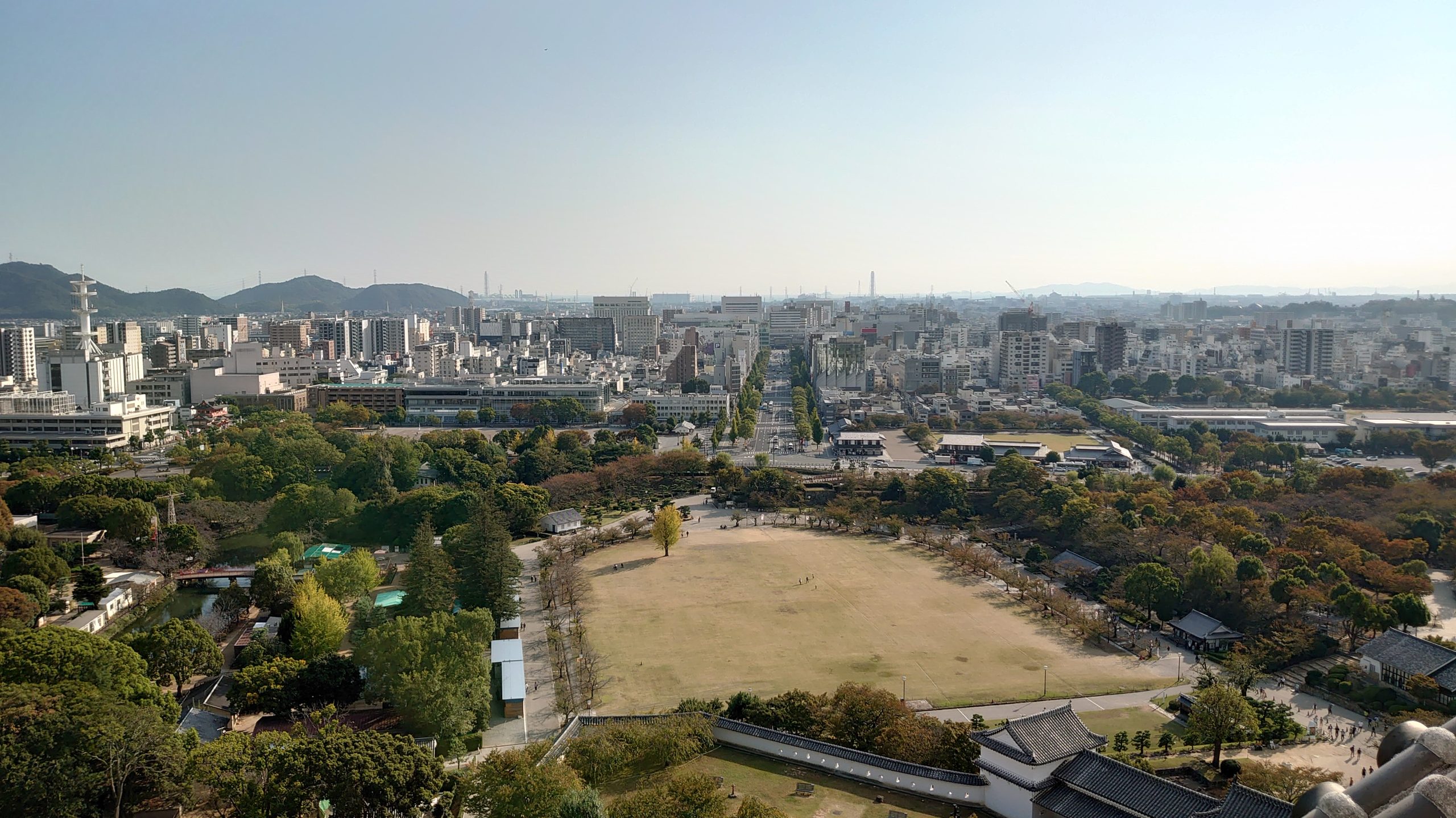 A bit of Himeji city from the top of the Himeji castle. A large park surrounded by buildings