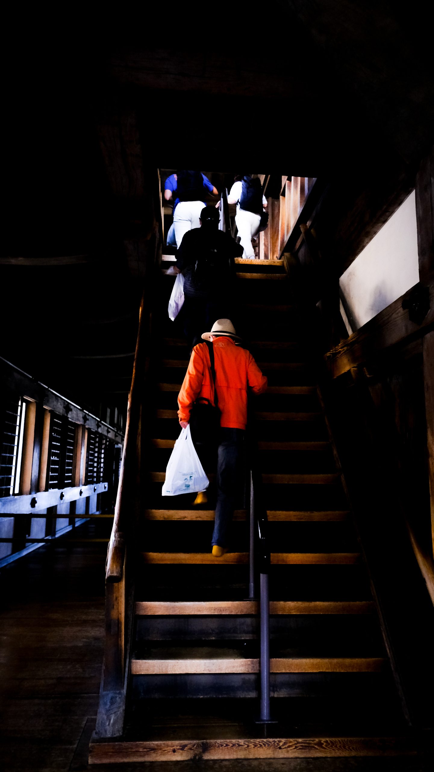 A few people going up stairs