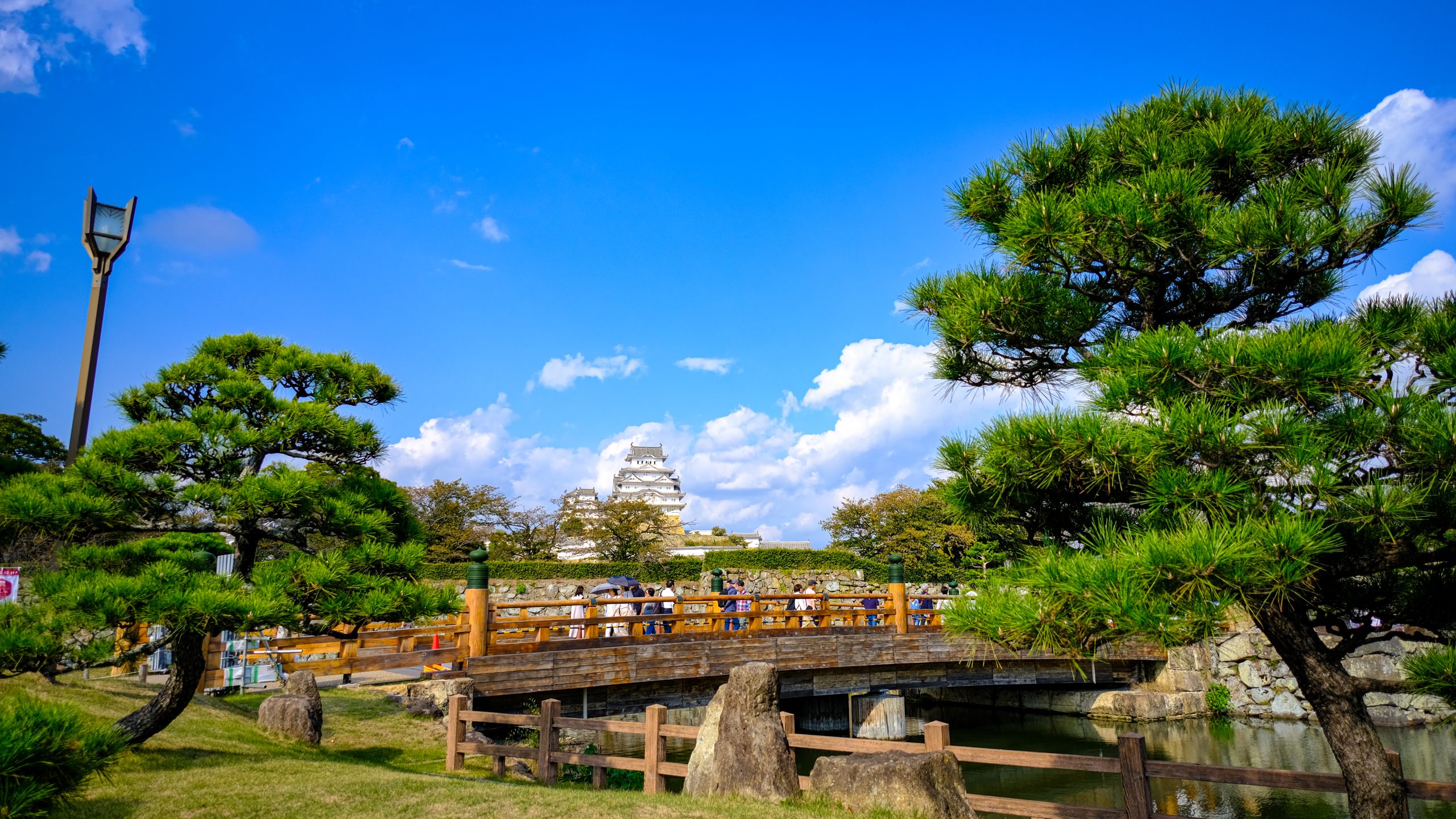 A view of the Himeji castle and an orange bridge in front of it